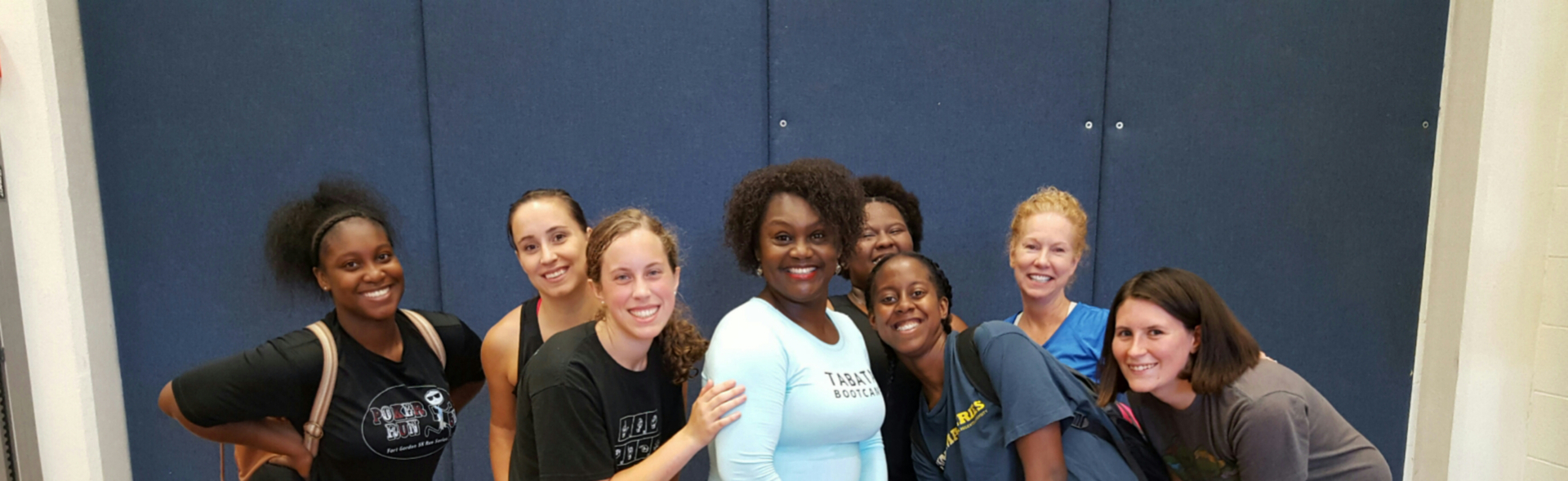 Jackie Dennis with a group of females after a wellness class smiling